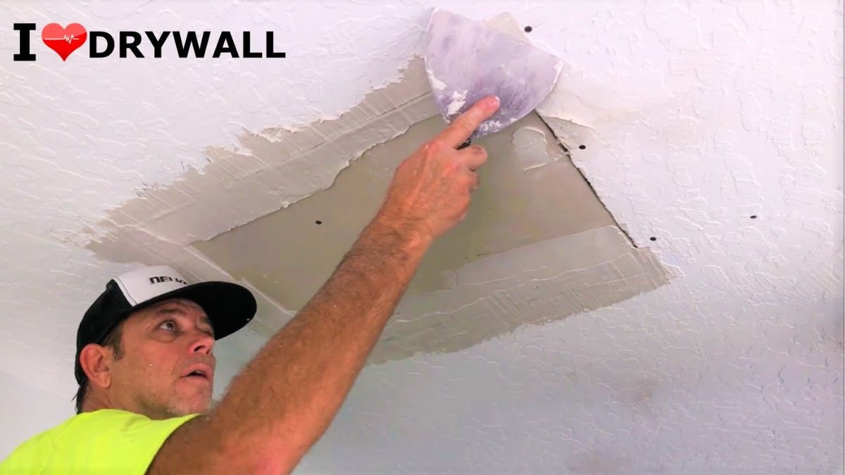 Water damaged ceiling being repaired